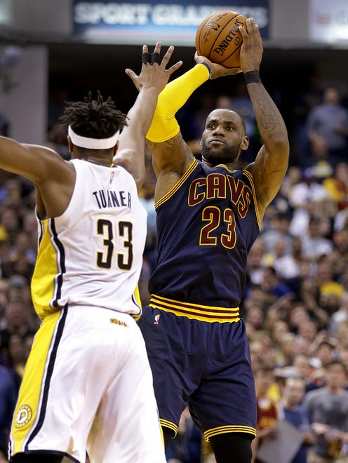 Cleveland Cavaliers forward LeBron James (23) puts up a three=pointer over Indiana Pacers center Myles Turner (33) in the second half of their NBA playoff basketball game Sunday, April 23, 2017, afternoon at Bankers Life Fieldhouse. The Pacers lost to the Cavaliers 106-102.