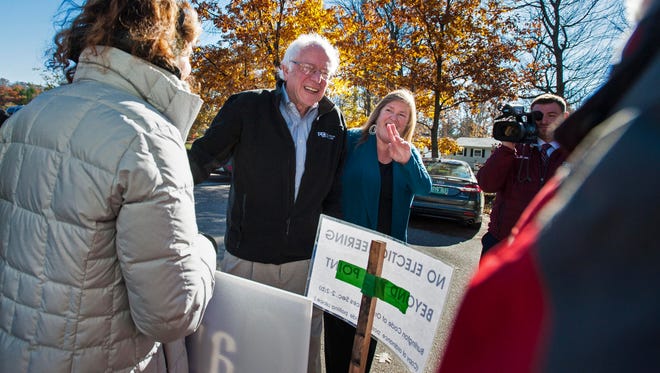 Former Democratic presidential candidate Sen. Bernie Sanders, I-VT, arrives with his wife Jane O'Meara Sanders to cast their ballots at the Robert Miller Community and Recreation Center in Burlington on Tuesday, November 8, 2016.