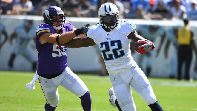 Tennessee Titans running back Derrick Henry (22) runs for a first down during the first half against the Minnesota Vikings at Nissan Stadium.