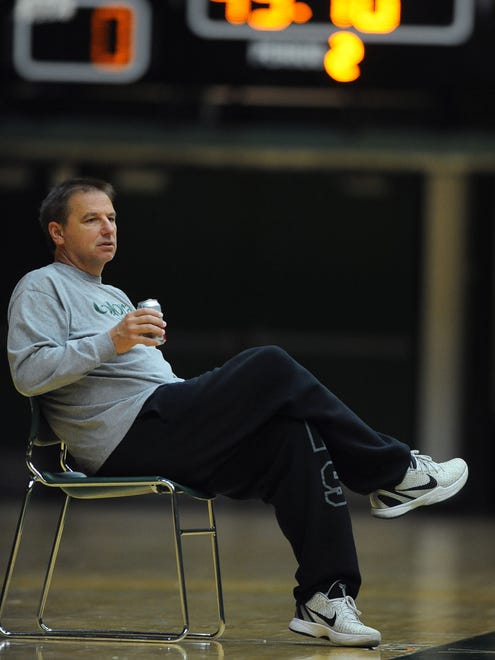 CSU basketball coach Larry Eustachy enjoys a Diet Coke while watching his team practice for the first time on Oct. 12, 2012, at Moby Arena.
