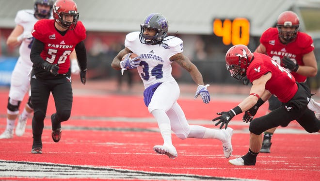 Central Arkansas running back Antwon Wells carries the ball against Eastern Washington during the first half of their FCS playoff game.