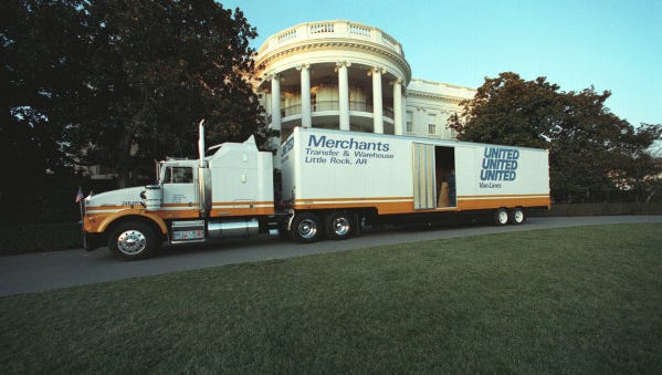 A moving van with the Clintons' belongings parks near the South Portico of the White House on the day of Bill Clinton's inauguration Jan. 20, 1993.