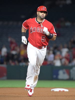 Los Angeles Angels designated hitter Albert Pujols (5) rounds the bases after hitting a two-run home run in the seventh inning against the Texas Rangers for his 610th career home run to move into eighth on the all-time home run list and the most by a foreign-born player during a MLB baseball game at Angel Stadium of Anaheim.
