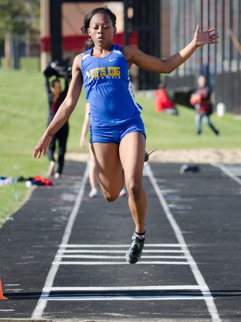 Milwaukee King's Mariah Williams competes in the girls long jump. She finished third with a jump of 17 feet.