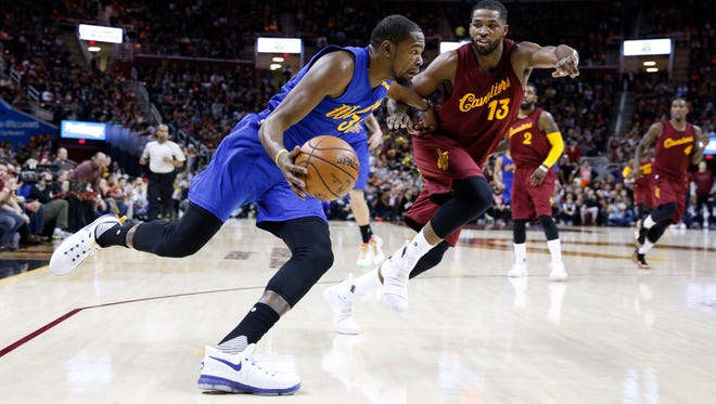 Golden State Warriors forward Kevin Durant (35) drives to the basket against Cleveland Cavaliers forward Tristan Thompson (13) at Quicken Loans Arena.