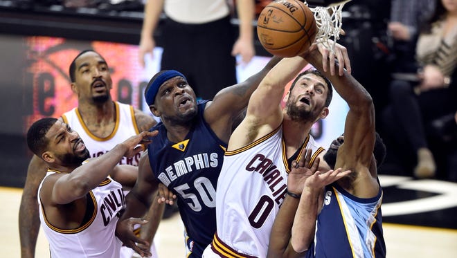 Dec 13, 2016; Cleveland, OH, USA; Memphis Grizzlies forward Zach Randolph (50) reaches for a rebound between Cleveland Cavaliers center Tristan Thompson (13) and forward Kevin Love (0) in the second quarter at Quicken Loans Arena. Mandatory Credit: David Richard-USA TODAY Sports