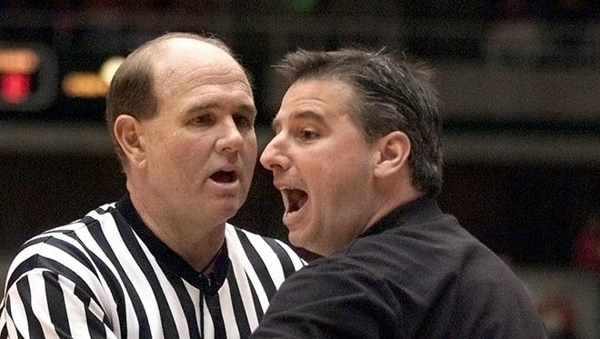 Iowa State head coach Larry Eustachy talks to an official about a foul in the second half of the team's Feb. 17, 2001, game against No. 6 Kansas in Ames. The Cyclones won 79-71.