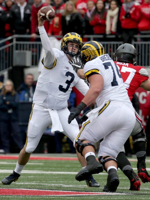 Michigan quarterback Wilton Speight throws downfield during the first half against Ohio State on Saturday, Nov. 26, 2016. The Buckeyes won in two overtimes, 30-27, at Ohio Stadium in Columbus, Ohio.