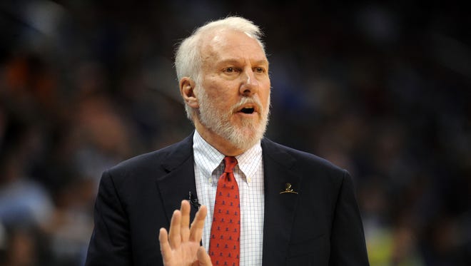 Apr 7, 2015; Oklahoma City, OK, USA; San Antonio Spurs head coach Gregg Popovich signals a play to his team in action against the Oklahoma City Thunder during the second quarter at Chesapeake Energy Arena.