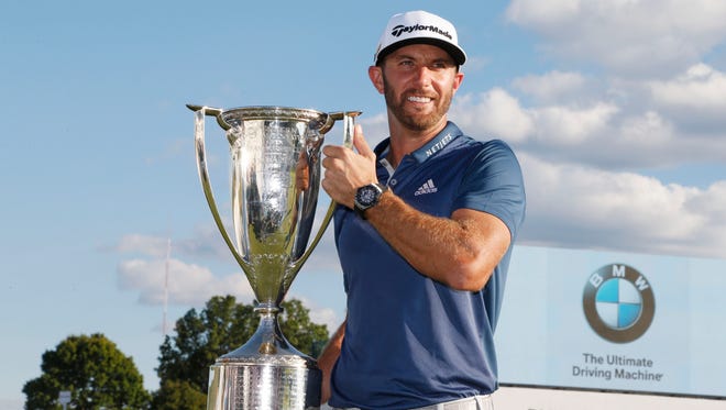 Sep 11, 2016; Carmel, IN, USA; Dustin Johnson poses with the Western Golf Association Trophy after winning the BMW Championship at Crooked Stick GC. Mandatory Credit: Brian Spurlock-USA TODAY Sports