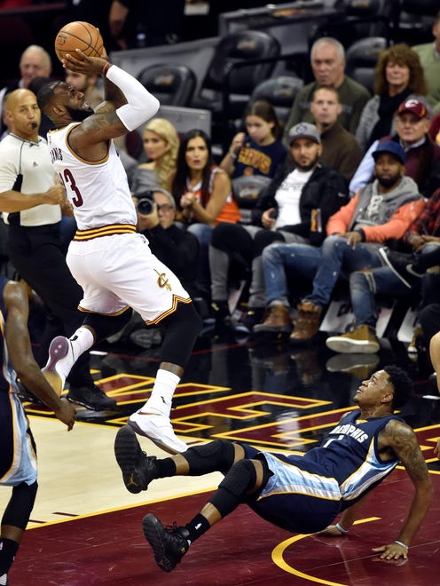 Dec 13, 2016; Cleveland, OH, USA; Cleveland Cavaliers forward LeBron James (23) drives to the basket against the Memphis Grizzlies forward Jarell Martin (1) in the second quarter at Quicken Loans Arena.