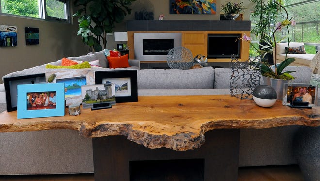 A live-edge table commands attention in the living room. The wood came from a neighbor.