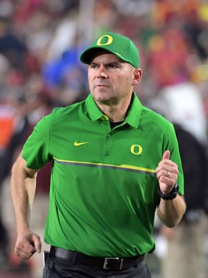Oregon Ducks head coach Mark Helfrich enters the field before a NCAA football game against the Southern California Trojans at Los Angeles Memorial Coliseum.