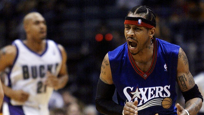 Allen Iverson reacts to the bench after making a basket in the fourth quarter of a game against the Milwaukee Bucks.