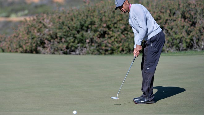 Tiger Woods putts on the 12th green during the second round of the Farmers Insurance Open golf tournament at Torrey Pines Municipal Golf Course - North Co.