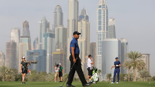 Woods plays on the 13th hole during the first round of the Dubai Desert Classic.