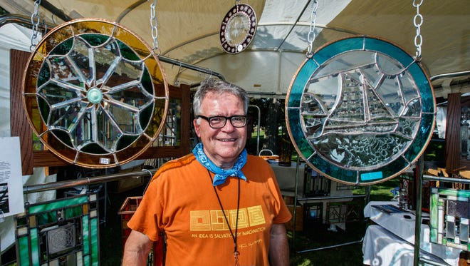 Artist John Larsen of Clear Lake Stained Glass welcomes visitors to his booth during the 47th annual Oconomowoc Festival of the Arts in Fowler Park on Saturday, August 19, 2017.