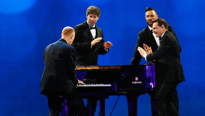 The Piano Guys perform at the Freedom Inaugural Ball at the Washington Convention Center in Washington.