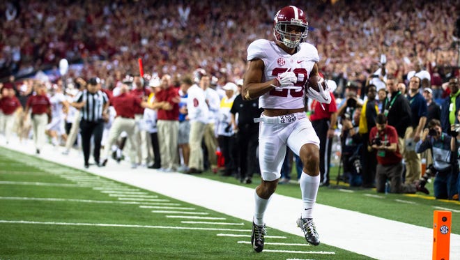 Alabama defensive back Minkah Fitzpatrick (29) scores a touchdown after an interception during the first half of the SEC Championship football game between Alabama and Florida on Saturday, Dec. 3, 2016, in Atlanta, Ga.