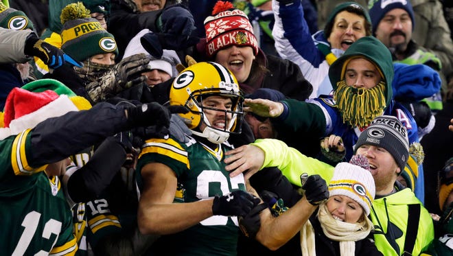 Packers wide receiver Jeff Janis (83) takes the Lambeau Leap after a second-half touchdown.