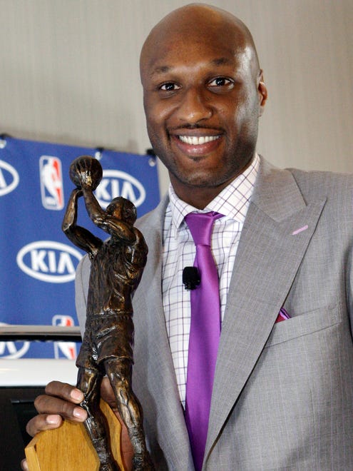 Los Angeles Lakers' Lamar Odom with his trophy as the winner of the 2010-2011 NBA Sixth Man Award, as the league's top reserve. (Apr 2011)