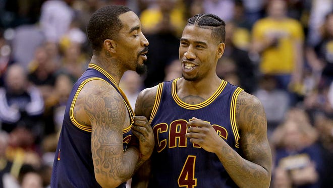 Cleveland Cavaliers guard JR Smith (5) and  Iman Shumpert (4) begin to celebrate their win late in the second half of their NBA playoff basketball game Sunday, April 23, 2017, afternoon at Bankers Life Fieldhouse. The Pacers lost to the Cavaliers 106-102.