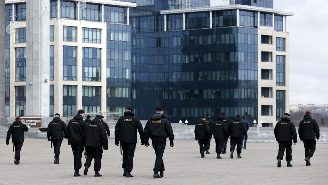 Police officers patrol a main square during an attempt to hold a rally in Minsk, Belarus on March 26, 2017. According to local media reports, several dozen protesters were detained in Minsk during an attempt to hold a rally.