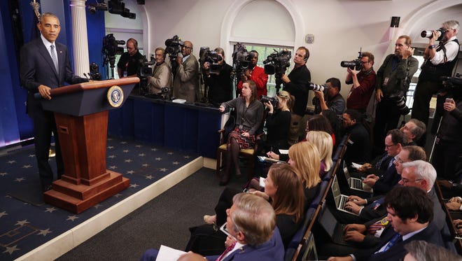 Obama answers questions from journalists during his first post-election press conference in the Brady Press Briefing Room at the White House on Nov. 14, 2016.