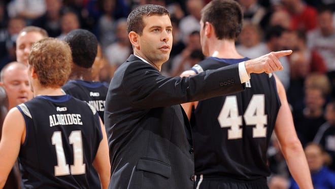 Butler's head coach Brad Stevens calls out a play in the first half of their game.The Bulldogs defeated the Hoosiers 88-86 in overtime of their 2012 Crossroads Classic game at Bankers Life Fieldhouse.  Matt Kryger / The Star