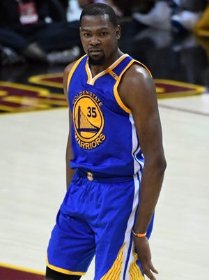 Kevin Durant celebrates after making a three-point basket during the fourth quarter in Game 3 of the NBA Finals.
