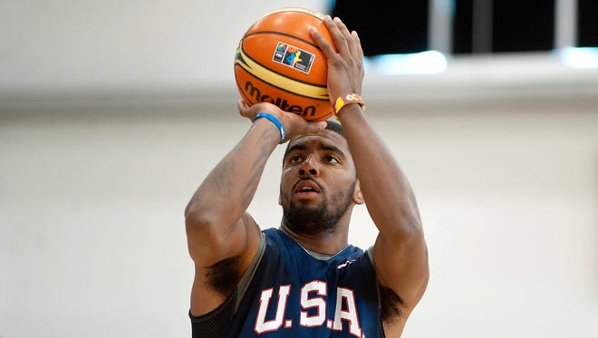 2014: Kyrie Irving takes a shot during a practice session at Mendenhall Center.