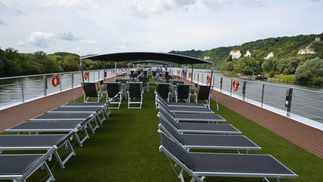 Artificial turf runs down the center of the Scenic Gems top deck.