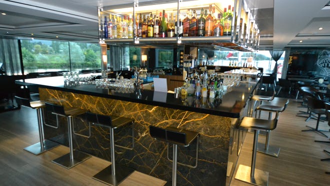 The Scenic Gem's lounge features a bar located at its center. Wine, beer and even spirits are included in the price of a cruise.