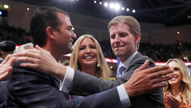 Donald Trump's children Donald Trump, Jr., Ivanka and Eric celebrate on the GOP national convention floor.