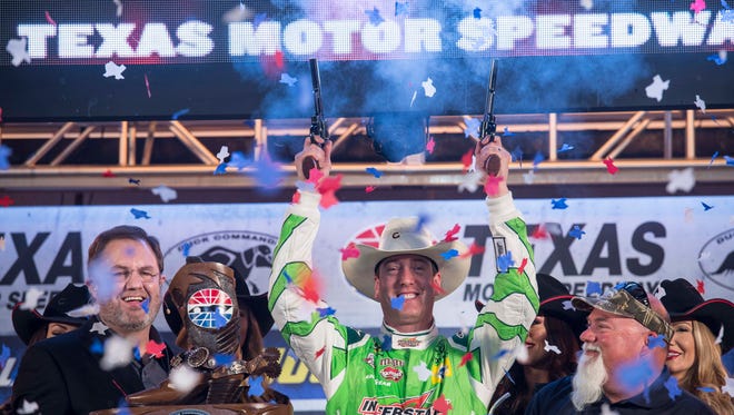 Kyle Busch celebrates after winning the Duck Commander 500 at Texas Motor Speedway, his second victory of the 2016 season.