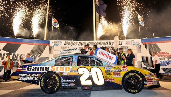 Joey Logano and his #20 GameStop Toyota are surrounded by fireworks in Victory Lane after taking first place in the NASCAR Nationwide Series Meijer 300 at Kentucky Speedway on June 12, 2010 in Sparta, Kentucky.