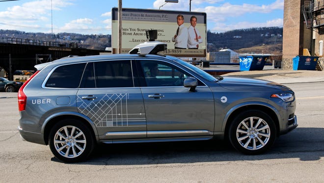 An Uber self-driving Volvo drives in Pittsburgh Friday, March 17, 2017.
