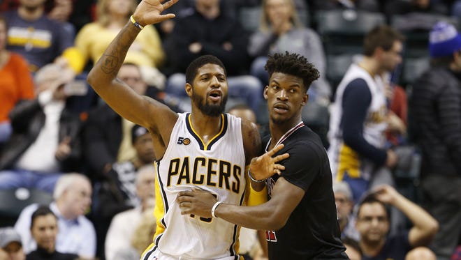 Indiana Pacers forward Paul George (13) is guarded by Chicago Bulls guard Jimmy Butler (21) at Bankers Life Fieldhouse. Indiana defeated Chicago 111-101.