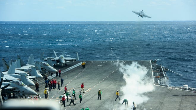 Flight operations aboard the USS Eisenhower from the vantage point of the ship’s bridge.