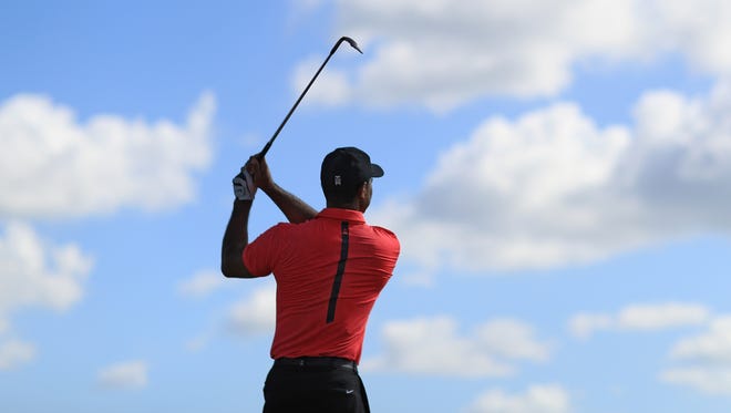 Tiger Woods warms up on the range prior to the final round of the Hero World Challenge.