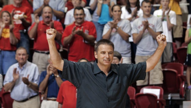Former Iowa State men's basketball coach Larry Eustachy responds to the cheers from the fans during introductions at the Hilton Magic All-Star Celebrity Basketball Game on Saturday, July 21, 2007, in Ames. Eustachy coached one of the teams. The event was held as a fundraiser for the family of former Iowa State star basketball player Barry Stevens. Stevens died in February of a heart attack.
