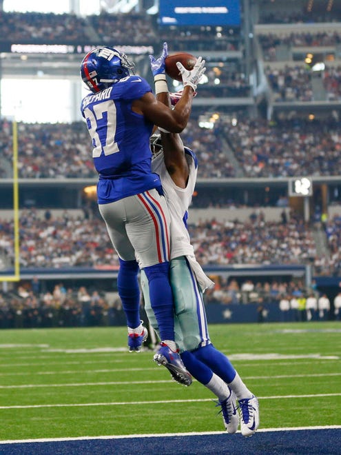 New York Giants wide receiver Sterling Shepard (87) catches a touchdown pass over Dallas Cowboys cornerback Anthony Brown (30).