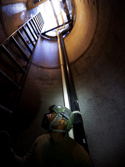 A member of the Border Patrol's Border Tunnel Entry Team looks up as he descends an entrance carved out by the Border Patrol leading to a tunnel spanning the border between San Diego and Tijuana, Mexico. Authorities have discovered more than 200 cross-border tunnels originating in Mexico since 1990, most of which entered the United States.