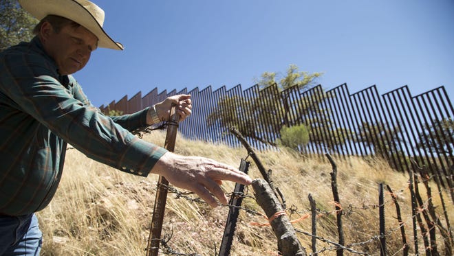 Arizona Border Rancher Dan Bell ranches 35,000 acres near United States-Mexico border. Bell said, at some spots, it's difficult to build the wall because of rugged terrain.