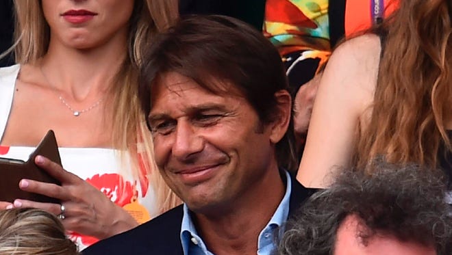 Chelsea football manager Antonio Conte sits in the Royal box on Centre Court for the men's singles final.