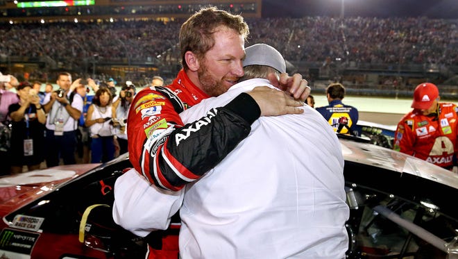 Dale Earnhardt Jr. (88) hugs team owner Rick Hendrick after the Ford EcoBoost 400 at Homestead-Miami Speedway, his final full-time race.