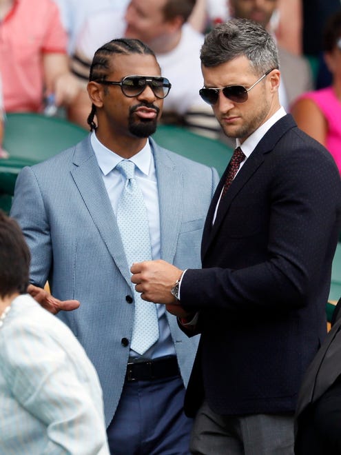 Boxers David Haye, left, and Carl Froch arrive to take their seats at Center Court.