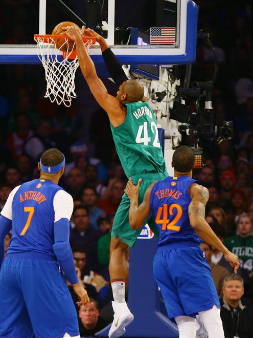 Boston Celtics center Al Horford (42) dunks the ball against the New York Knicks during the first half at Madison Square Garden.