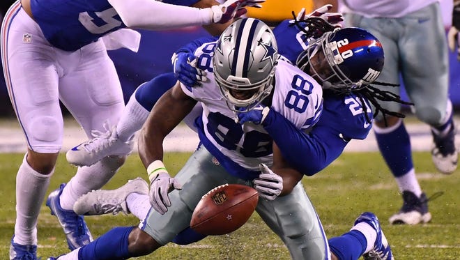 Cowboys wide receiver Dez Bryant (88) fumbles the ball late in the fourth quarter against the Giants.