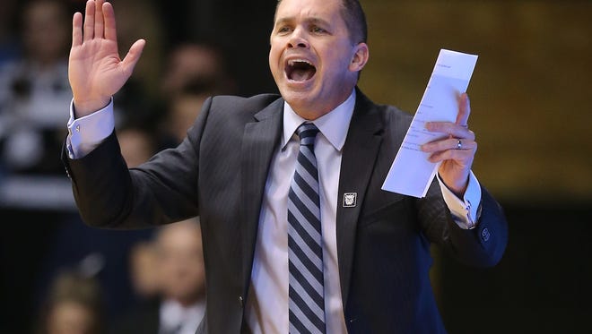 Butler Bulldogs head coach Chris Holtmann calls in a play to his players in the first half of their game.